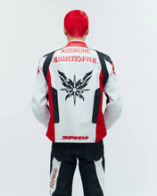 Person wearing a white jacket with red and black accents, featuring branding on a white background